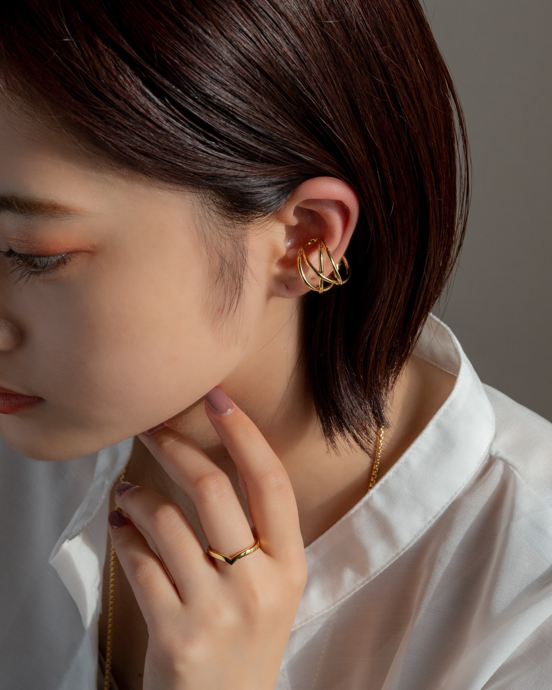 Cross line ear cuff